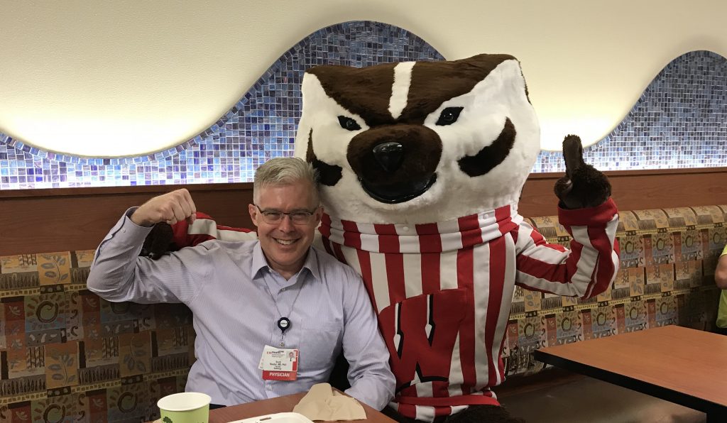 Photograph of Dr. Scott Reeder with Buck Badger, the UW - Madison mascot.